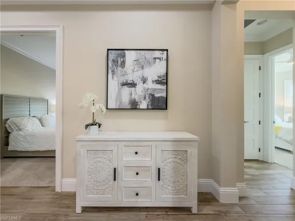 a living room with hard wood floors and a wooden floor