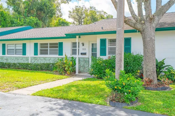 front view of a house with a yard