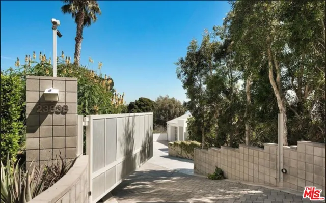 a view of a wrought iron fences in front of house