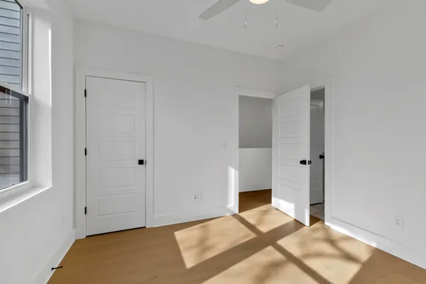 a view of a big room with windows