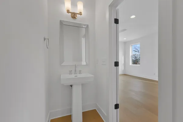 a bathroom with a sink and mirror