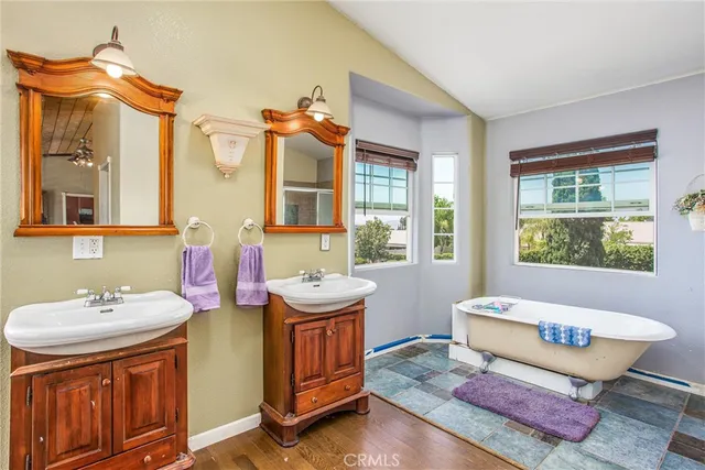 a bathroom with a sink mirror and a bathtub