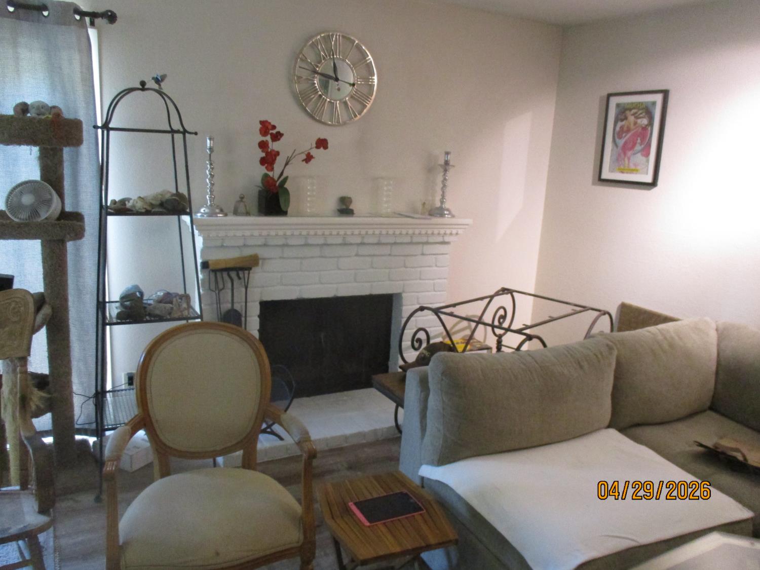 11024 Autumnwind Lane Rancho Cordova, CA 95670 - Photo 11 of 36 a living room with furniture and a fireplace