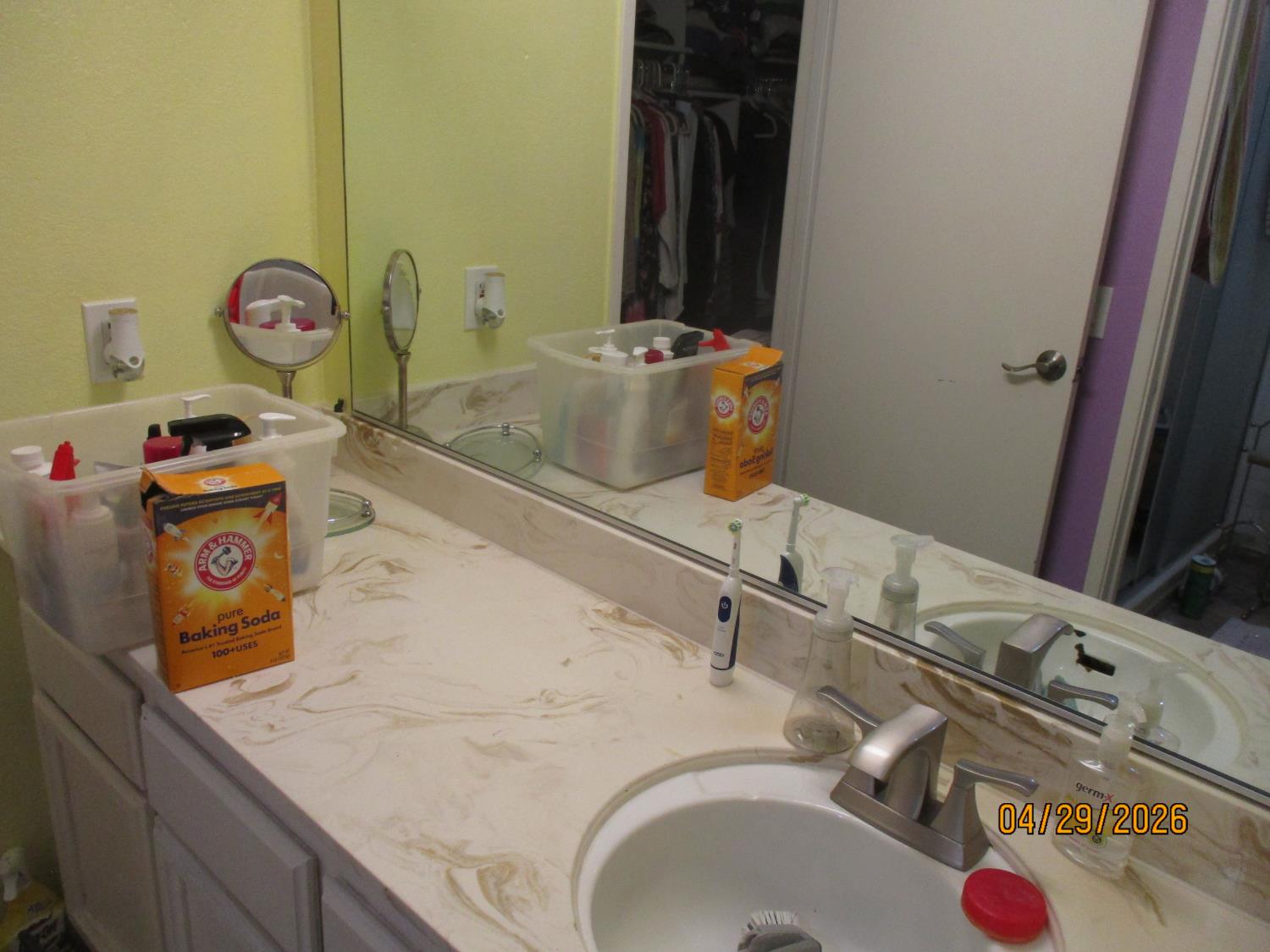 11024 Autumnwind Lane Rancho Cordova, CA 95670 - Photo 21 of 36 a bathroom with a granite countertop sink and a mirror