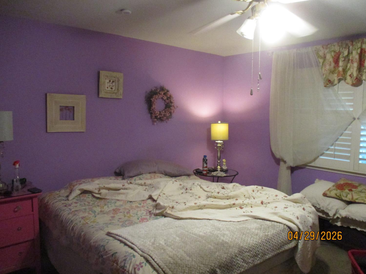 11024 Autumnwind Lane Rancho Cordova, CA 95670 - Photo 22 of 36 a bed room with a bed and a lamp