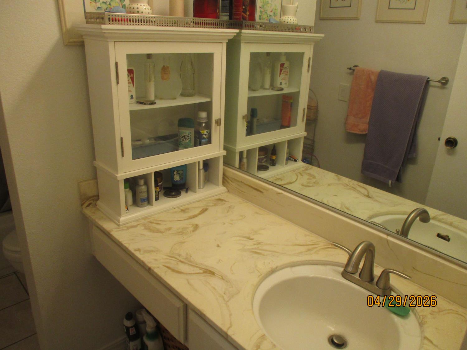 11024 Autumnwind Lane Rancho Cordova, CA 95670 - Photo 25 of 36 a bathroom with a sink and mirror