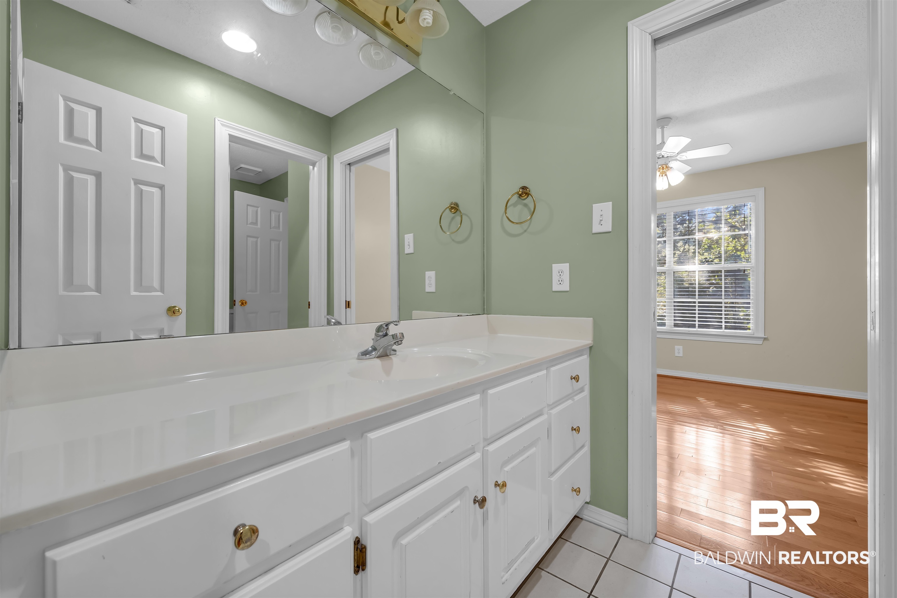 1262 Patrick Street Daphne, AL 36526 - Photo 22 of 35 Bathroom featuring vanity, light tile patterned floors, and a ceiling fan