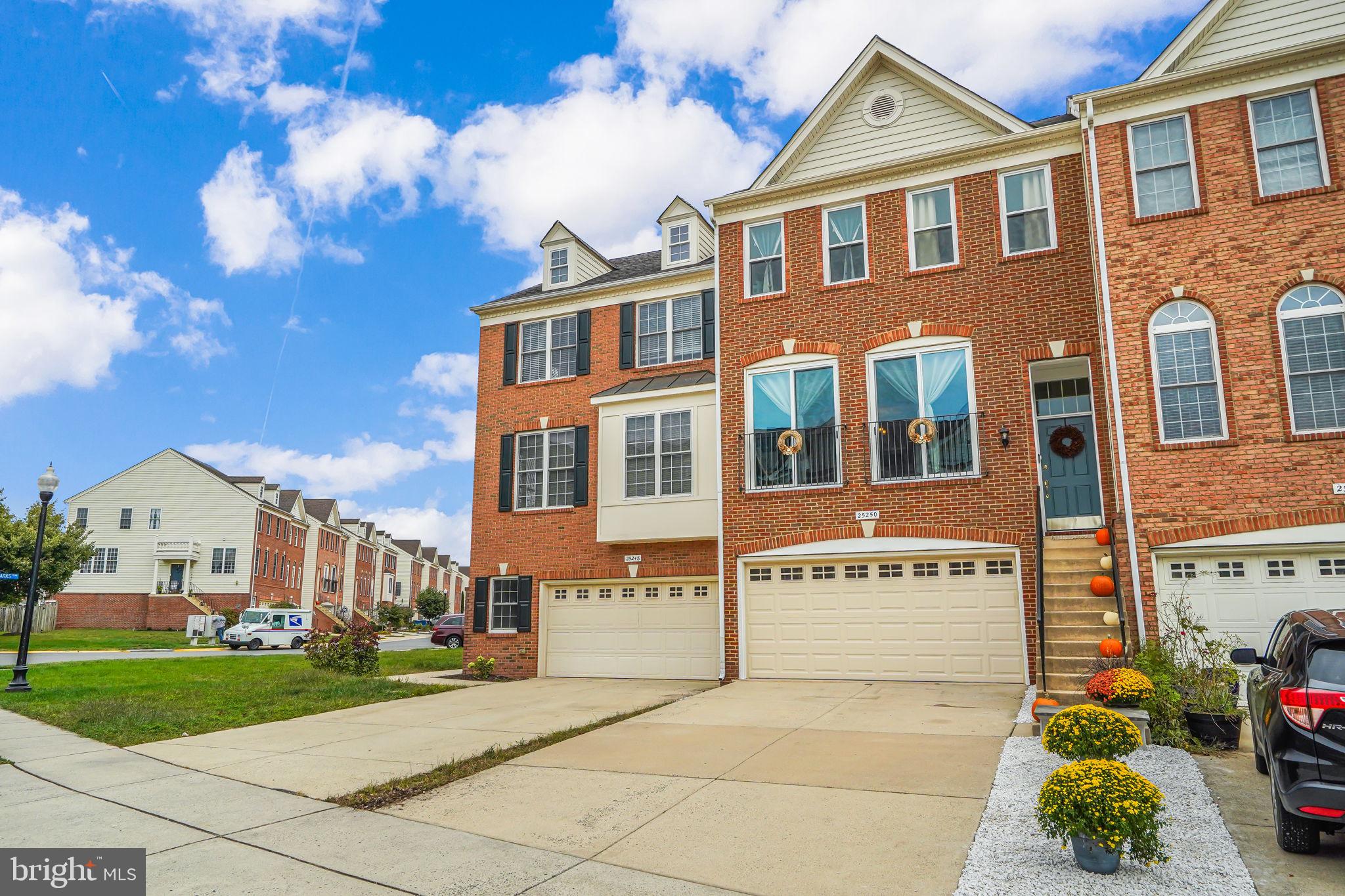 25250 Bald Eagle Terrace Chantilly, VA 20152 - Photo 1 of 34 a front view of a building with garden