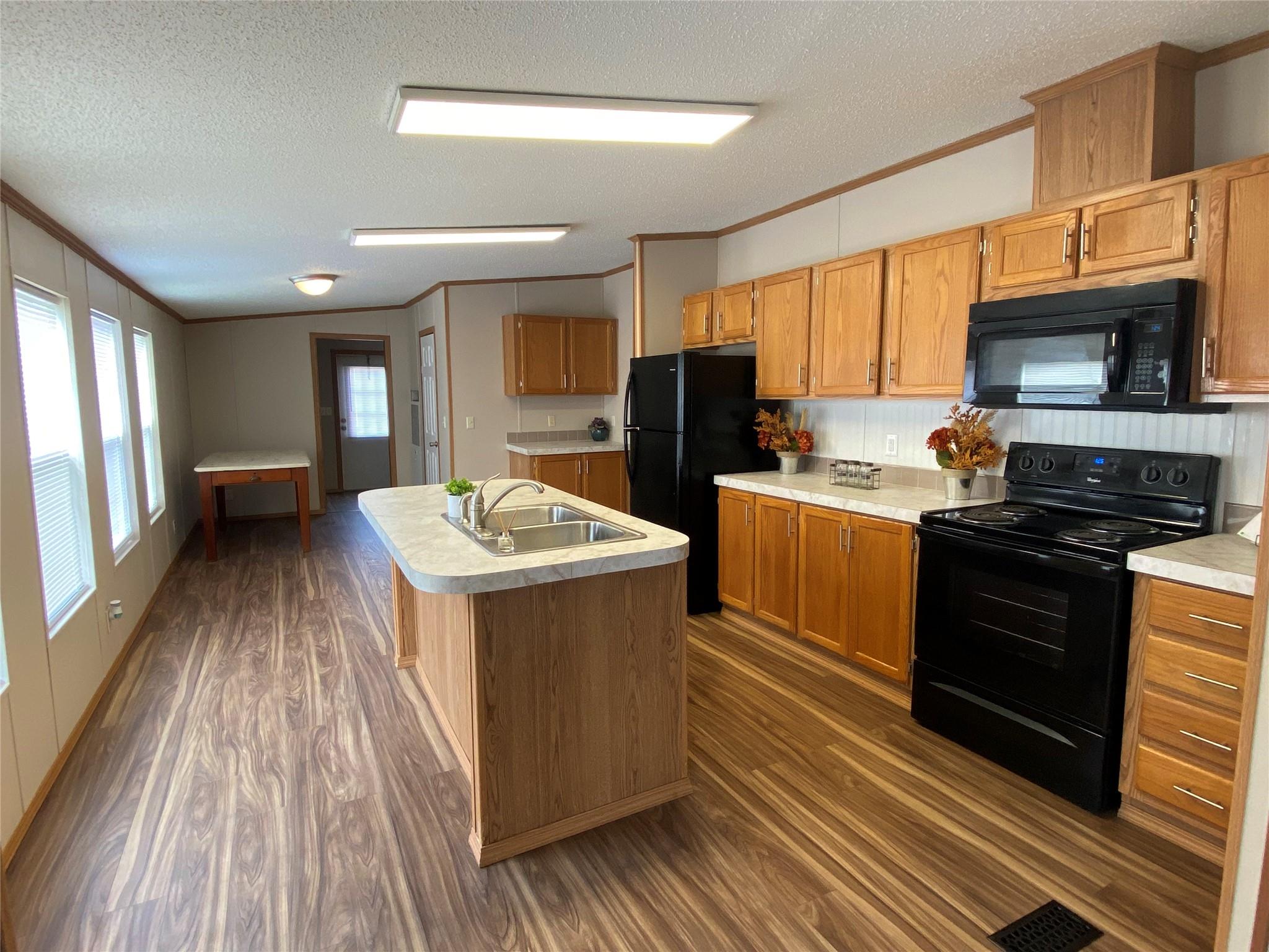 180 Tryon Road Rockwell, NC 28138 - Photo 14 of 31 a kitchen with sink a microwave and refrigerator