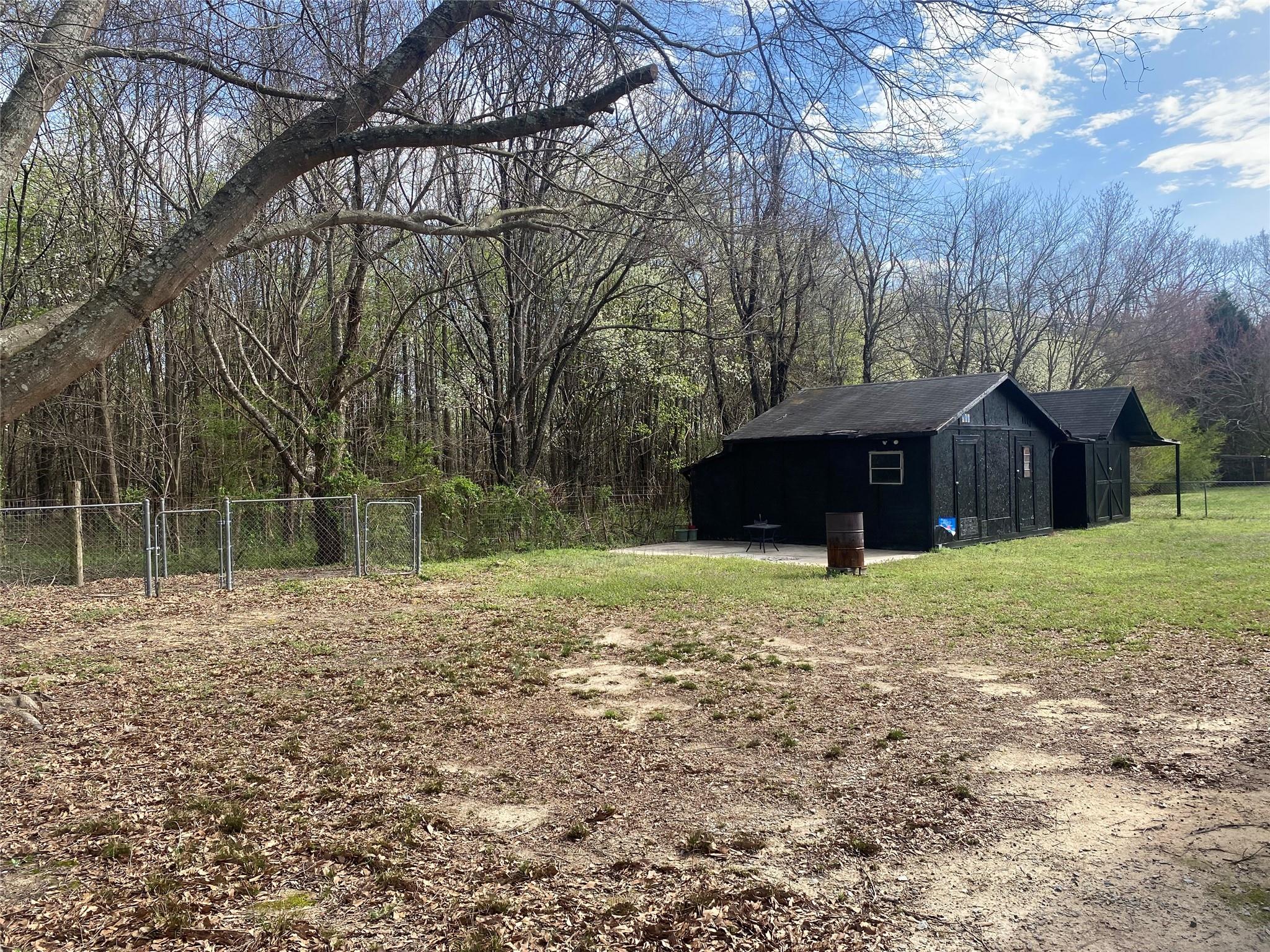 180 Tryon Road Rockwell, NC 28138 - Photo 3 of 31 a backyard of a house with lots of green space