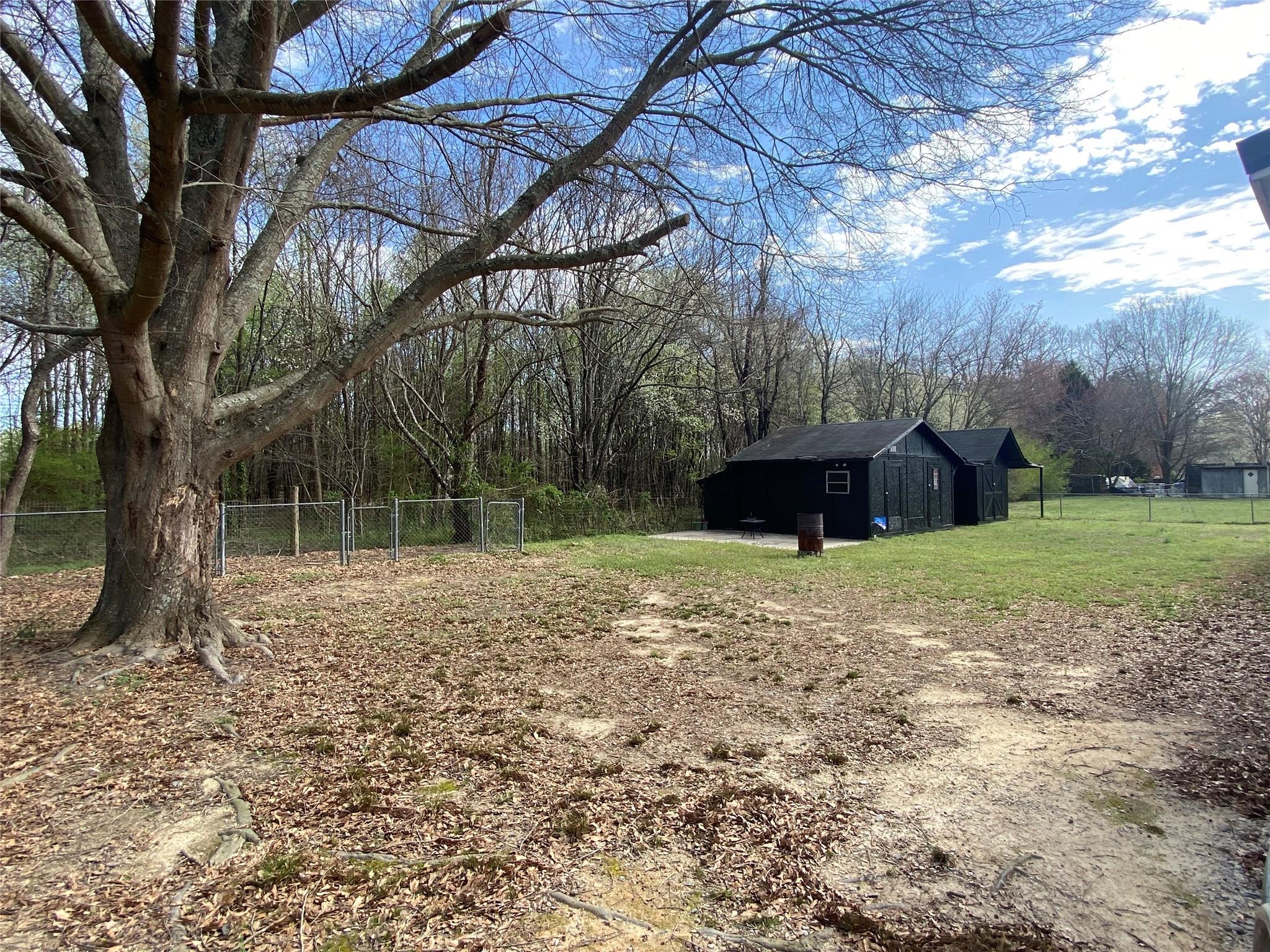 180 Tryon Road Rockwell, NC 28138 - Photo 5 of 31 a backyard of a house with lots of green space