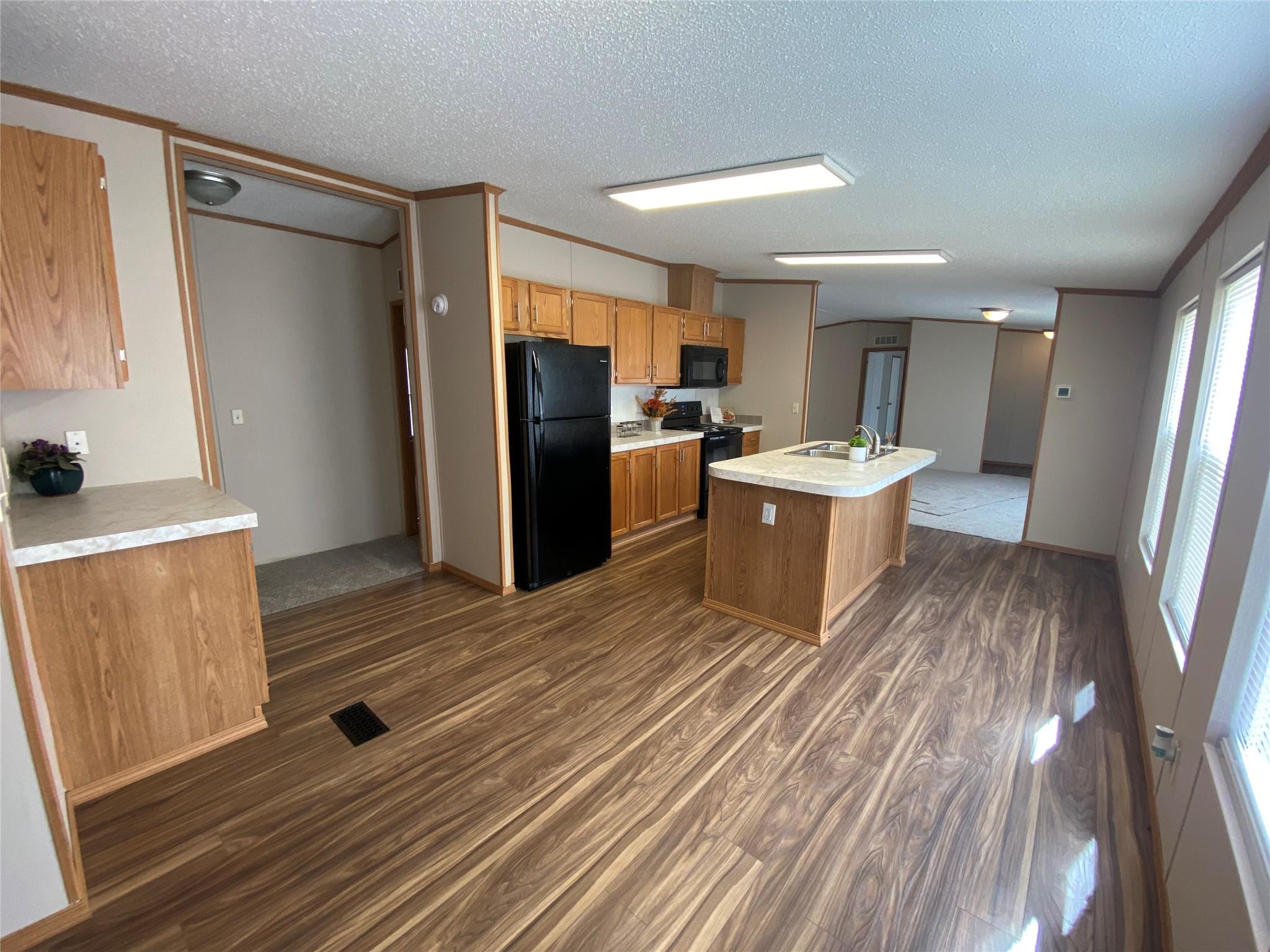 180 Tryon Road Rockwell, NC 28138 - Photo 8 of 31 a kitchen with a refrigerator and a sink