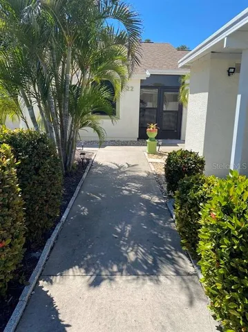 a view of a backyard with potted plants
