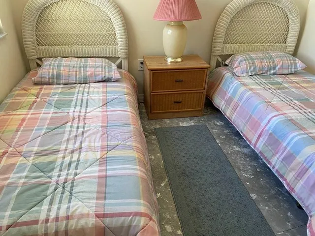 a kitchen with granite countertop a sink and a white wooden cabinets