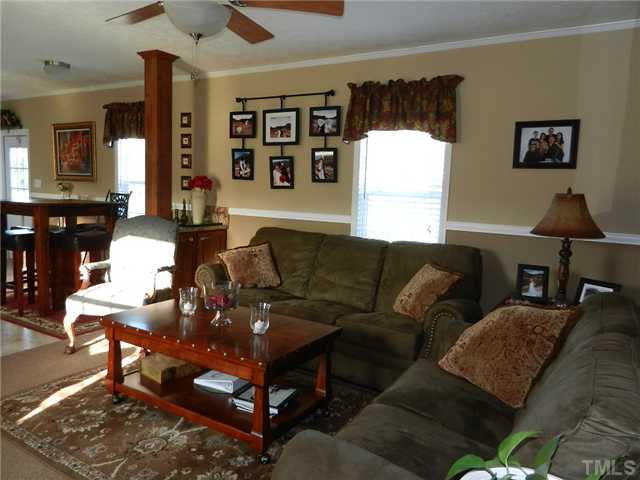 1184 Sykes Road Spring Hope, NC 27882 - Photo 9 of 12 a living room with furniture and wooden floor