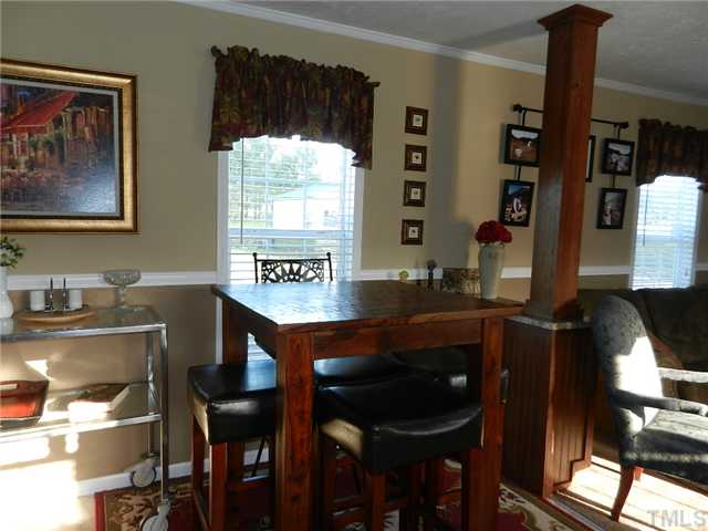 1184 Sykes Road Spring Hope, NC 27882 - Photo 10 of 12 a view of a dining room with furniture