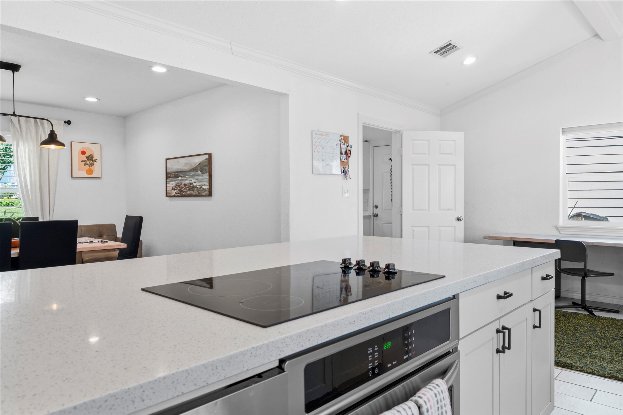 102 Enchanted Oaks Court Spring, TX 77388 - Photo 22 of 48 The electric cooktop directly above the stainless steel oven.