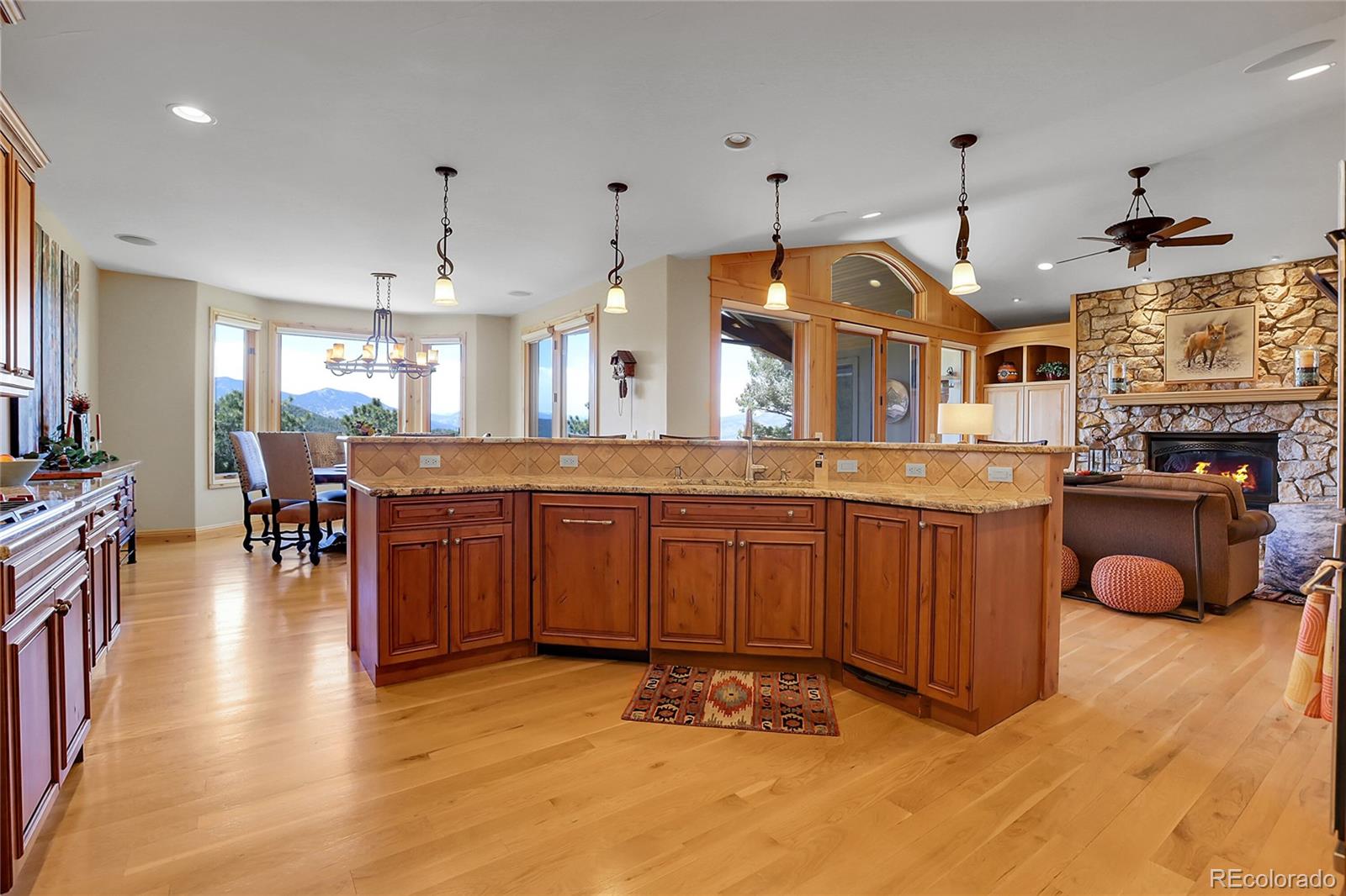 1007 Nob Hill Road Evergreen, CO 80439 - Photo 13 of 48 a large kitchen with lots of counter space and stainless steel appliances