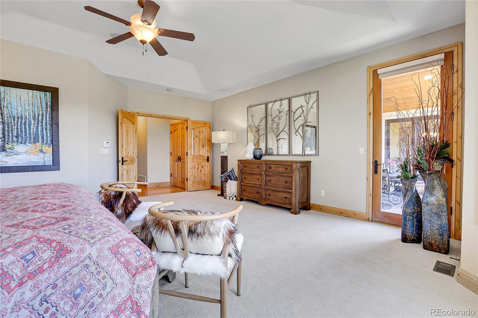 1007 Nob Hill Road Evergreen, CO 80439 - Photo 20 of 48 a bedroom with 2 bed and a chandelier
