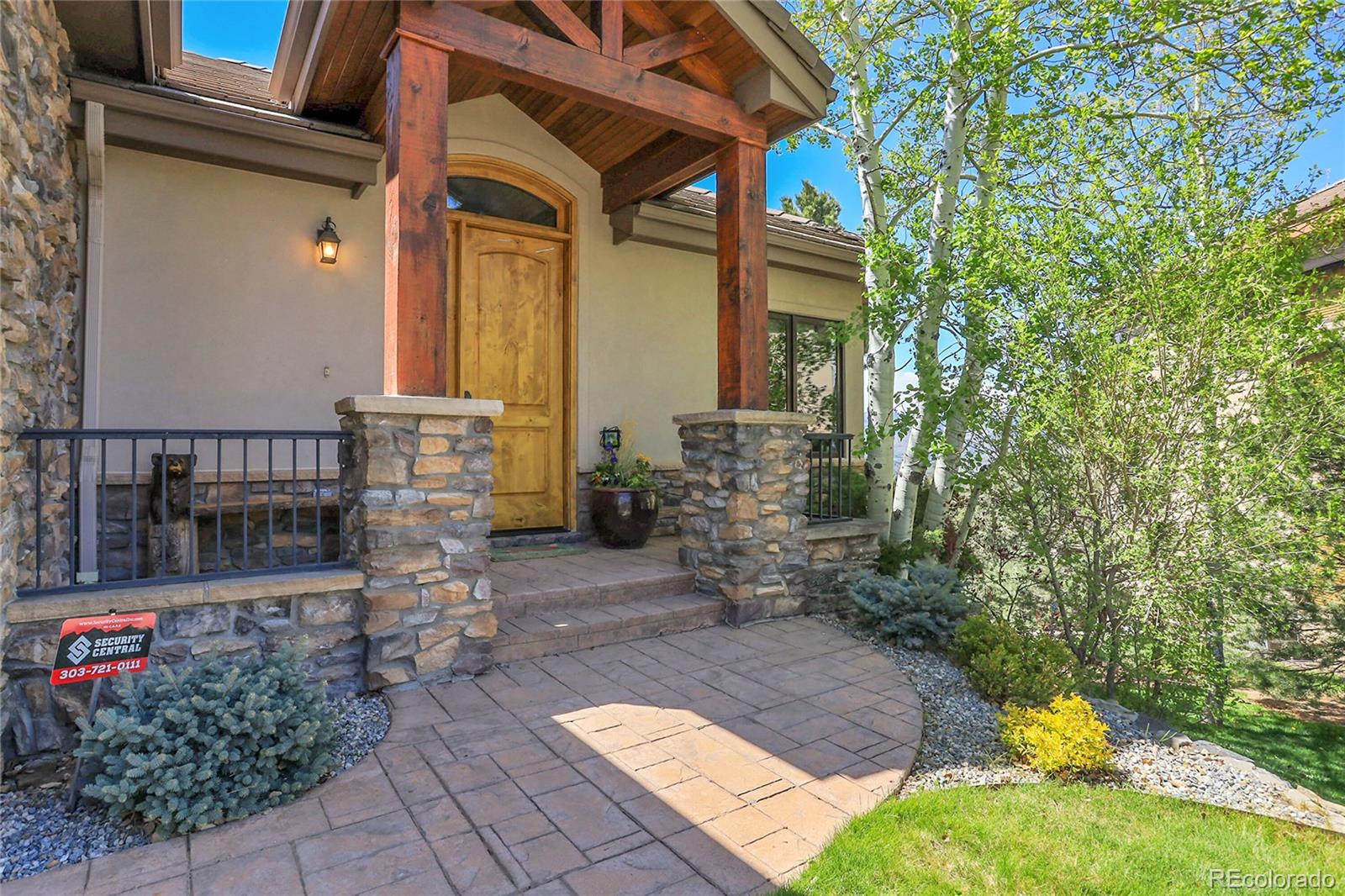 1007 Nob Hill Road Evergreen, CO 80439 - Photo 3 of 48 a view of front door of house with outdoor seating