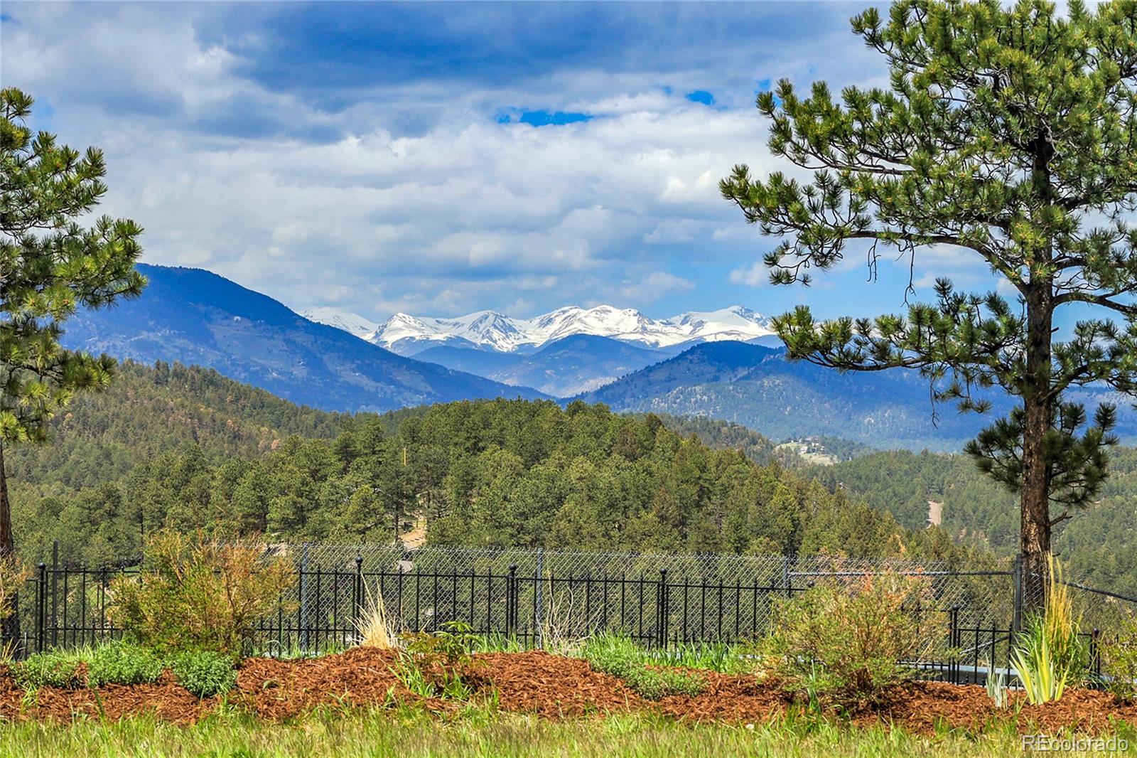 1007 Nob Hill Road Evergreen, CO 80439 - Photo 37 of 48 a view of lake with mountain in the background
