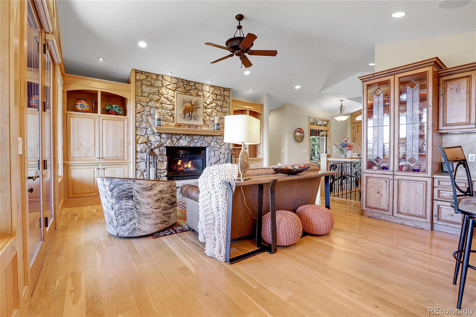1007 Nob Hill Road Evergreen, CO 80439 - Photo 8 of 48 a living room with furniture fireplace and kitchen view