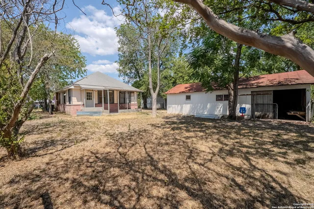 a view of a backyard of the house