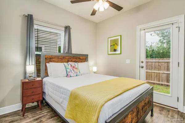 a bedroom with a bed and a window