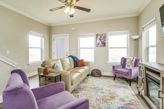 a living room with furniture and a large window