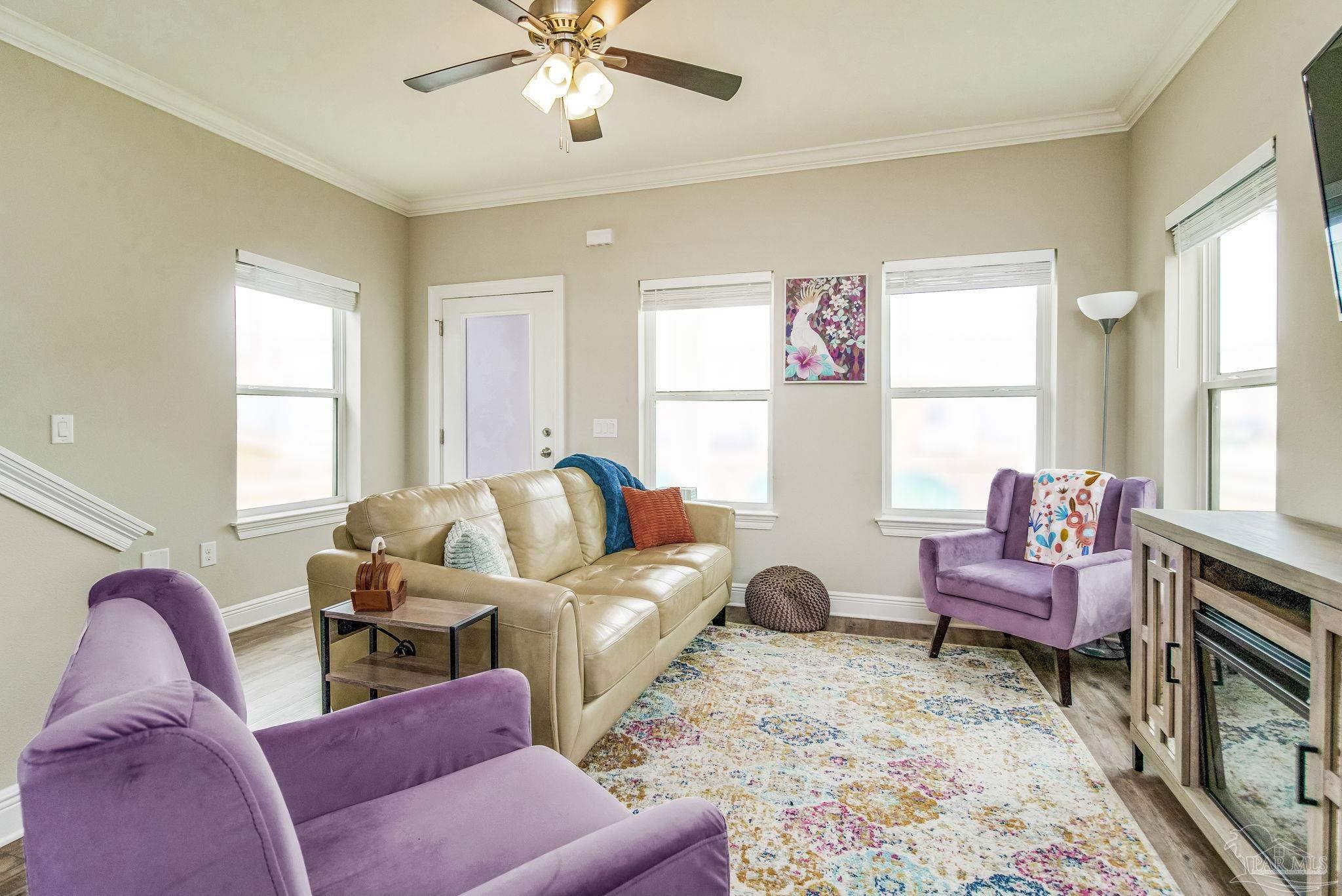 1002 West Main Street Pensacola, FL 32502 - Photo 2 of 32 a living room with furniture and a large window