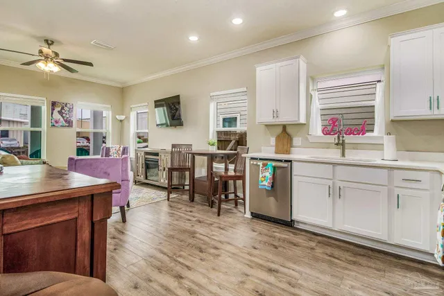 a open kitchen with stainless steel appliances granite countertop a lot of counter space and wooden floors