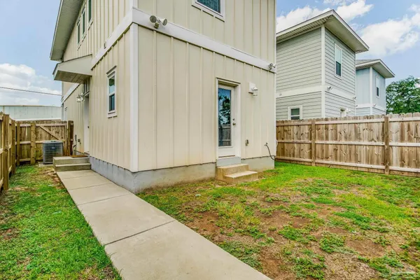 a backyard of a house with lots of green space