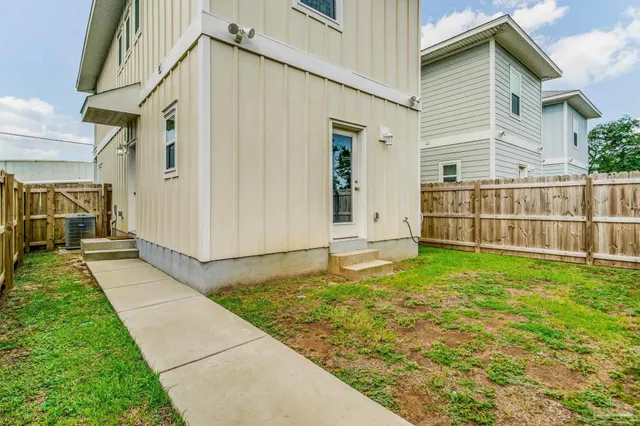 a backyard of a house with lots of green space
