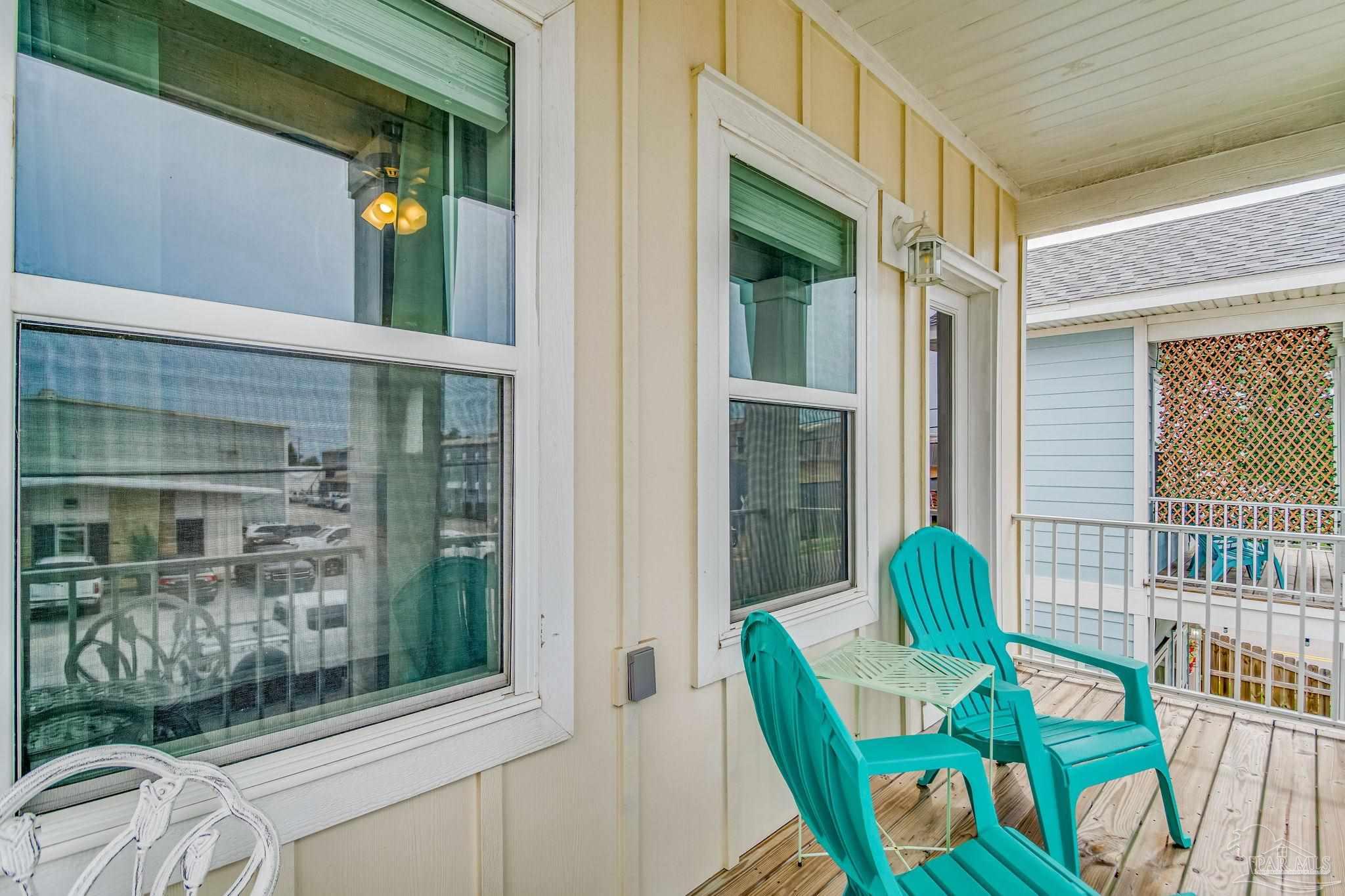 1002 West Main Street Pensacola, FL 32502 - Photo 28 of 32 a view of balcony with two chairs and door