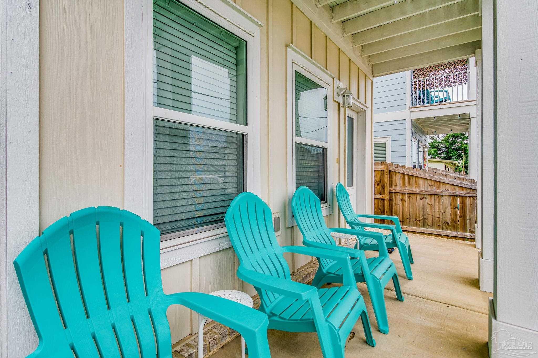 1002 West Main Street Pensacola, FL 32502 - Photo 30 of 32 a view of balcony with two chairs and a potted plant