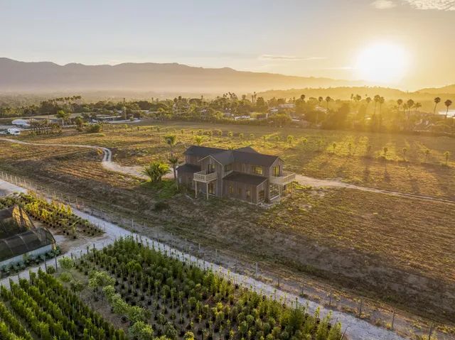 an aerial view of residential house and lake view