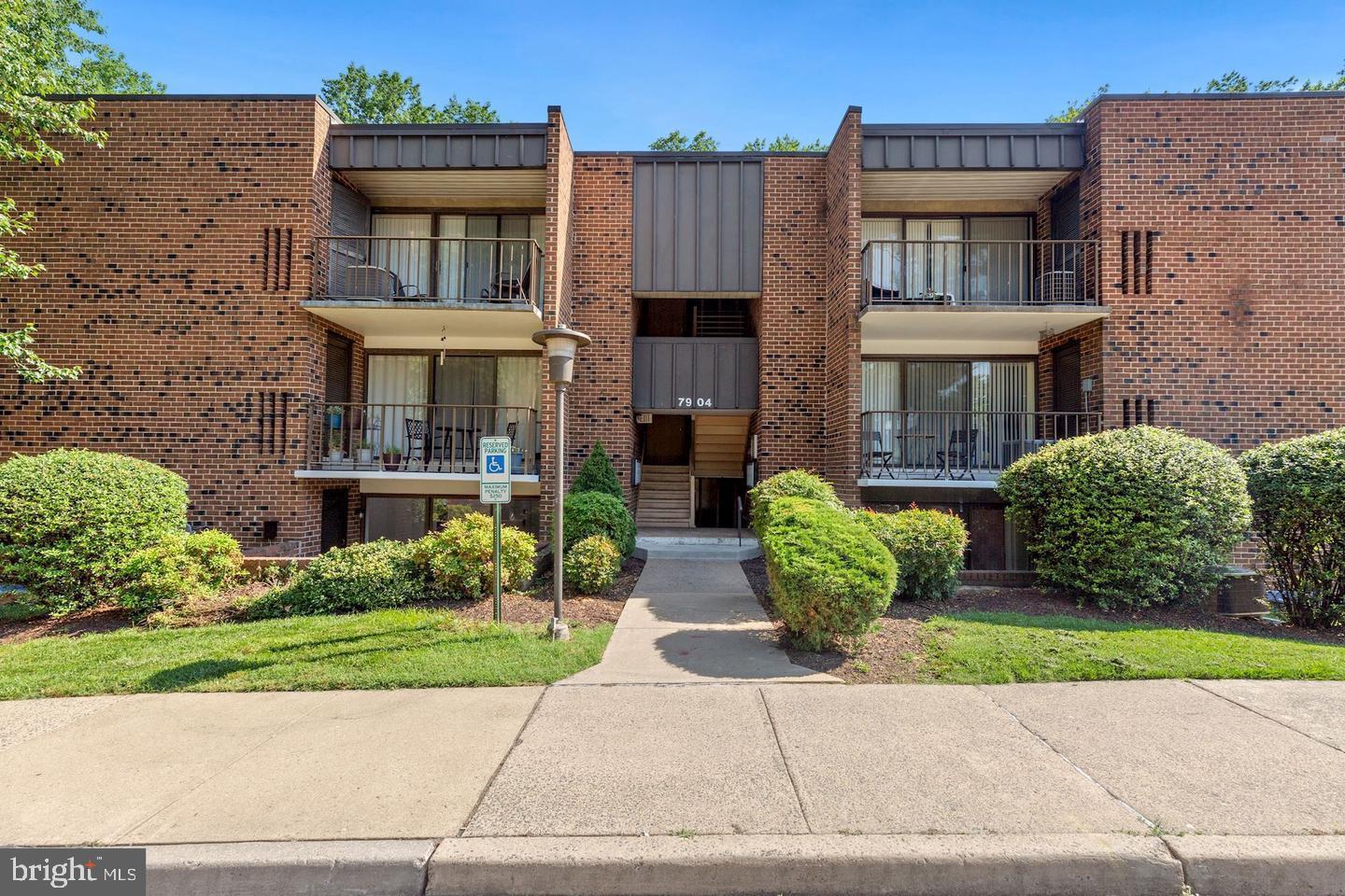 7904 Inverton Road, Unit 204 Annandale, VA 22003 - Photo 1 of 24 a front view of a house with garden and plants