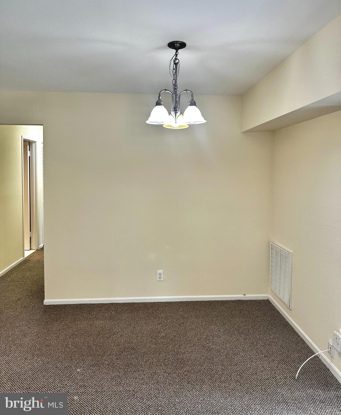 7904 Inverton Road, Unit 204 Annandale, VA 22003 - Photo 12 of 24 a view of a room with a hanging light and kitchen view
