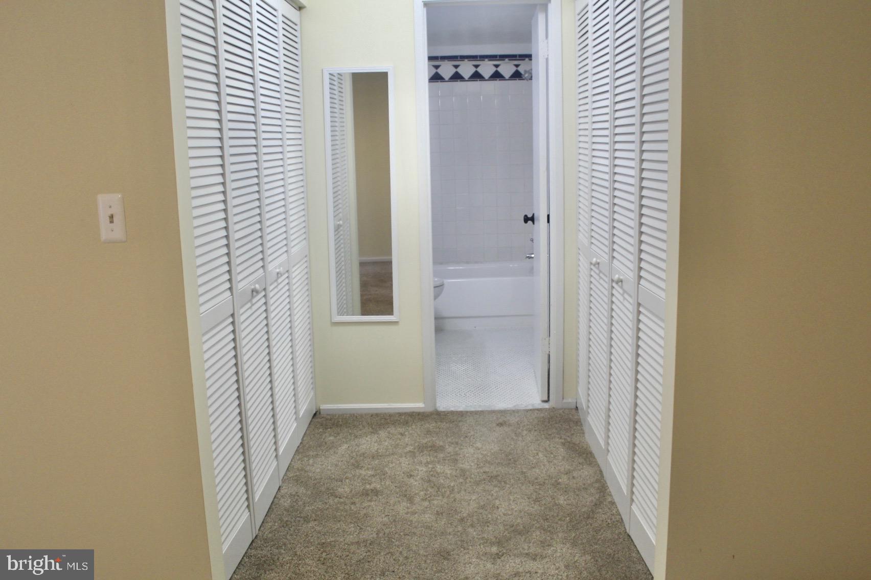 7904 Inverton Road, Unit 204 Annandale, VA 22003 - Photo 14 of 24 a view of a bathroom from a hallway