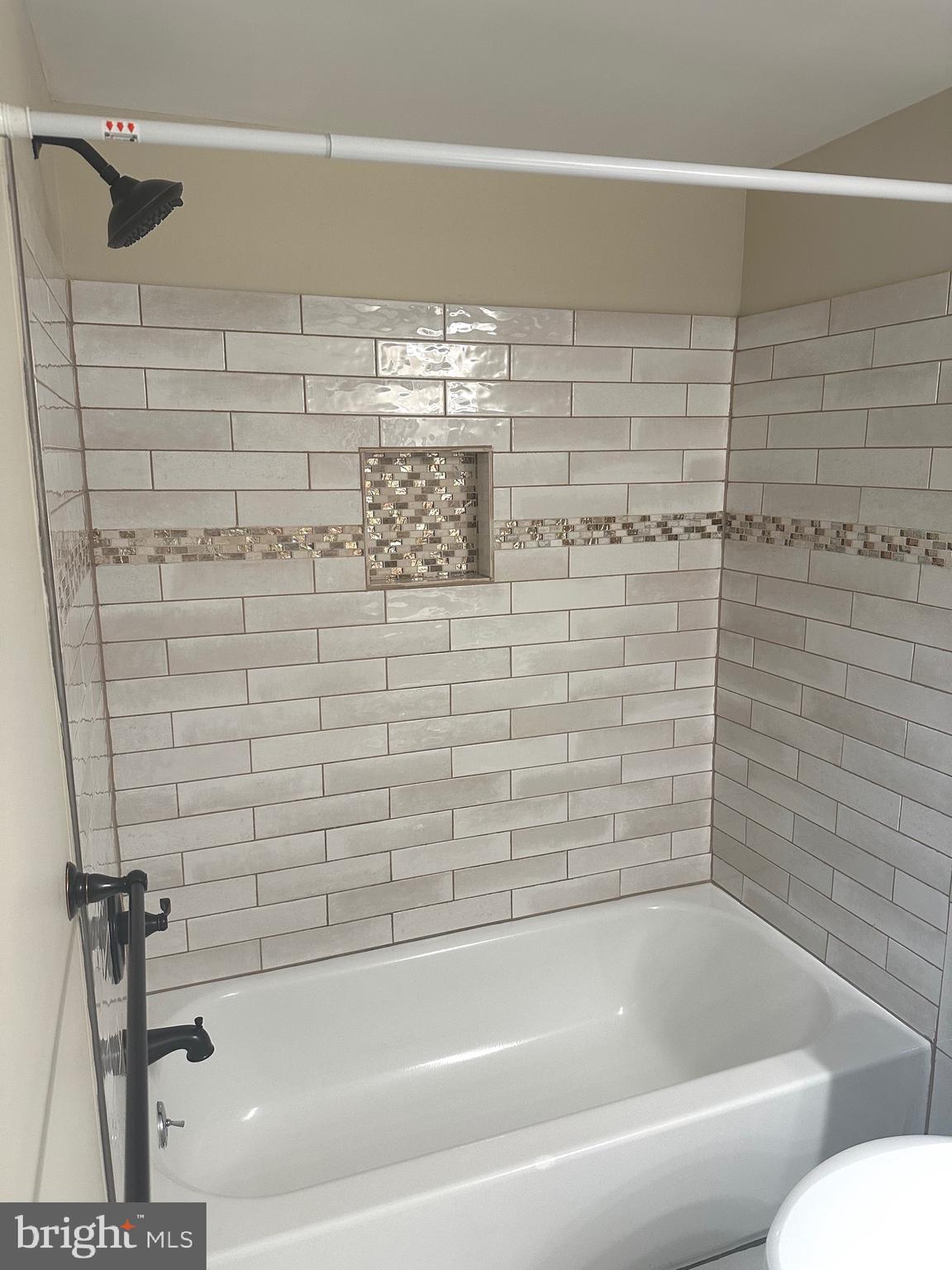 7904 Inverton Road, Unit 204 Annandale, VA 22003 - Photo 20 of 24 a bathroom with a bathtub