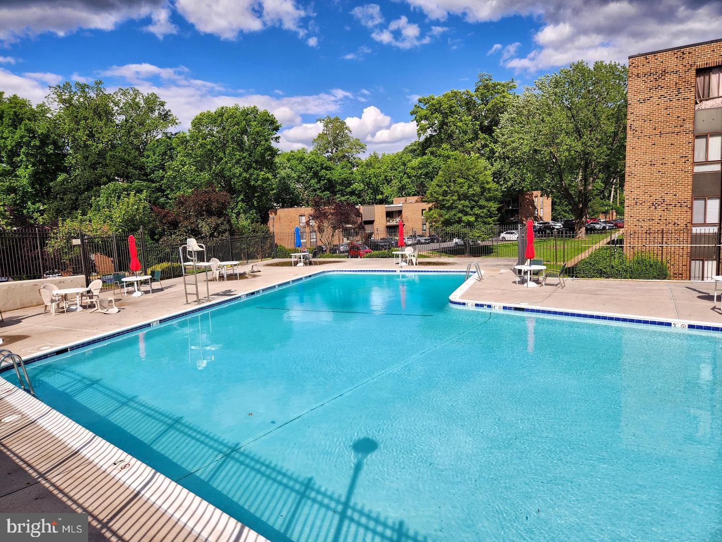 7904 Inverton Road, Unit 204 Annandale, VA 22003 - Photo 2 of 24 a view of a swimming pool with an outdoor seating