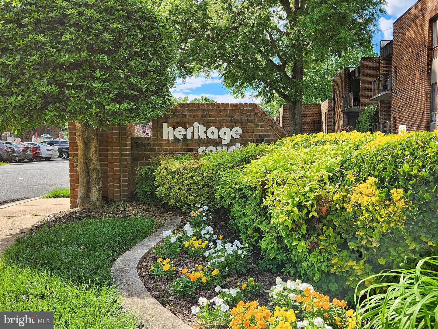 7904 Inverton Road, Unit 204 Annandale, VA 22003 - Photo 22 of 24 a front view of a house with a yard