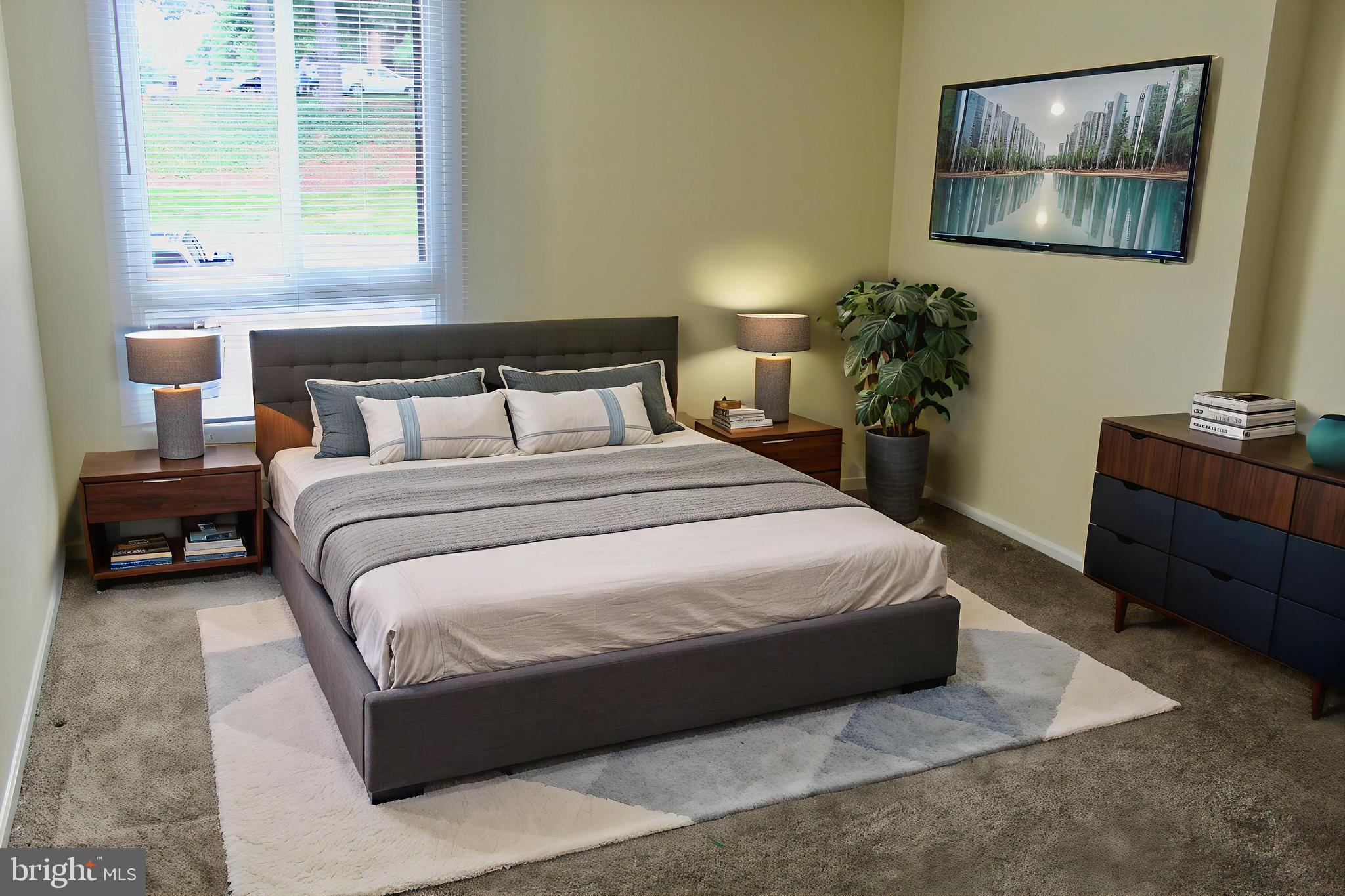 7904 Inverton Road, Unit 204 Annandale, VA 22003 - Photo 4 of 24 a bedroom with a bed and painting on the wall