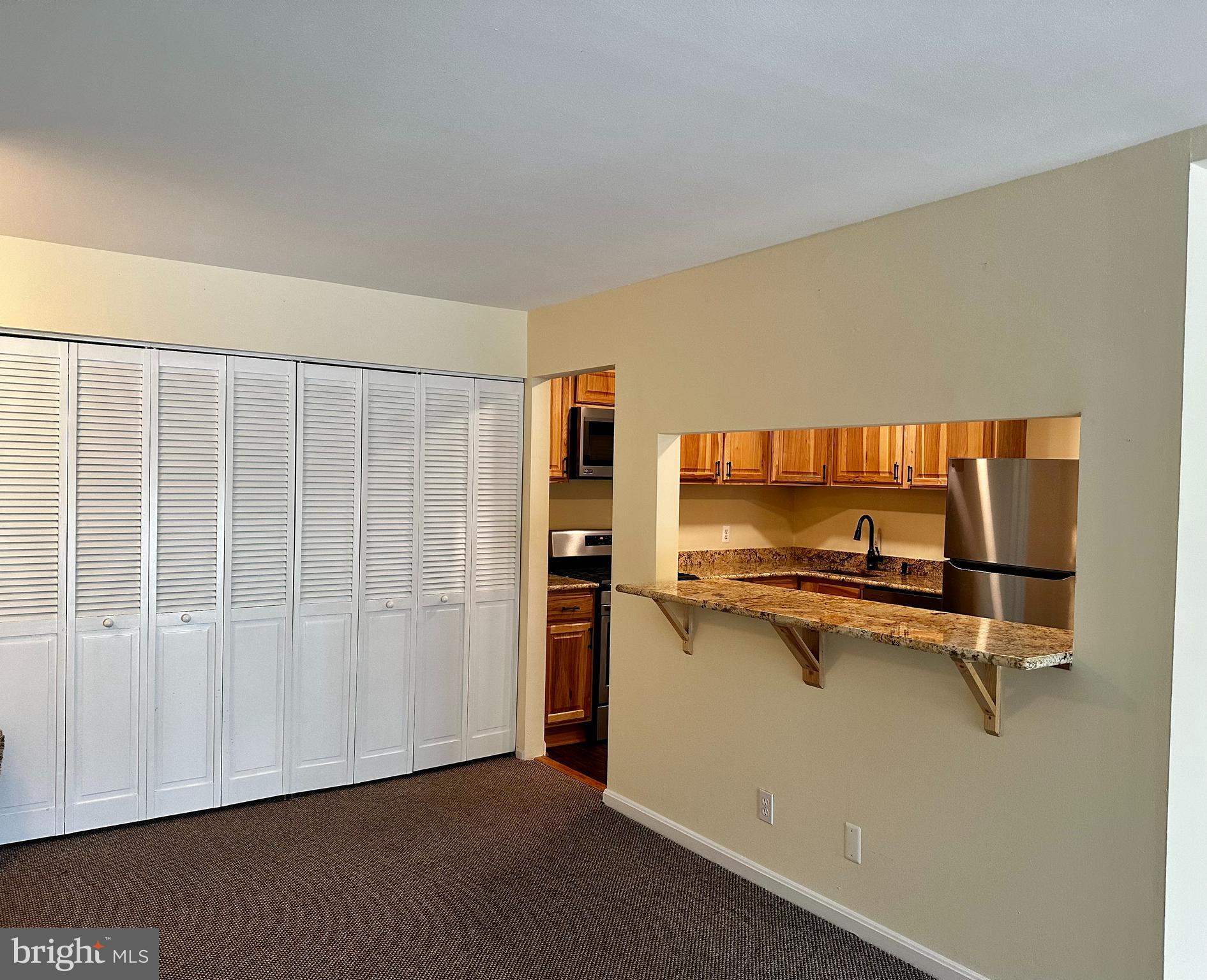 7904 Inverton Road, Unit 204 Annandale, VA 22003 - Photo 9 of 24 a view of a room with rack on the wall