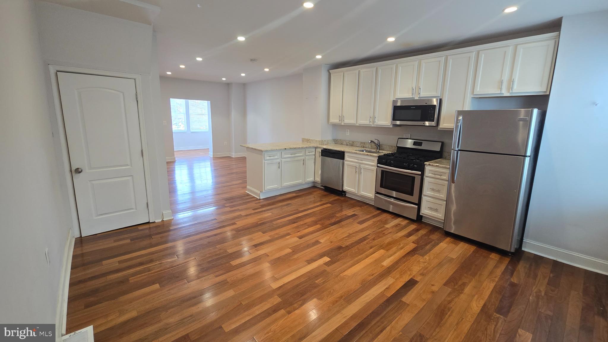 6814 Harford Road Baltimore, MD 21234 - Photo 11 of 27 a kitchen with stainless steel appliances a refrigerator sink and microwave