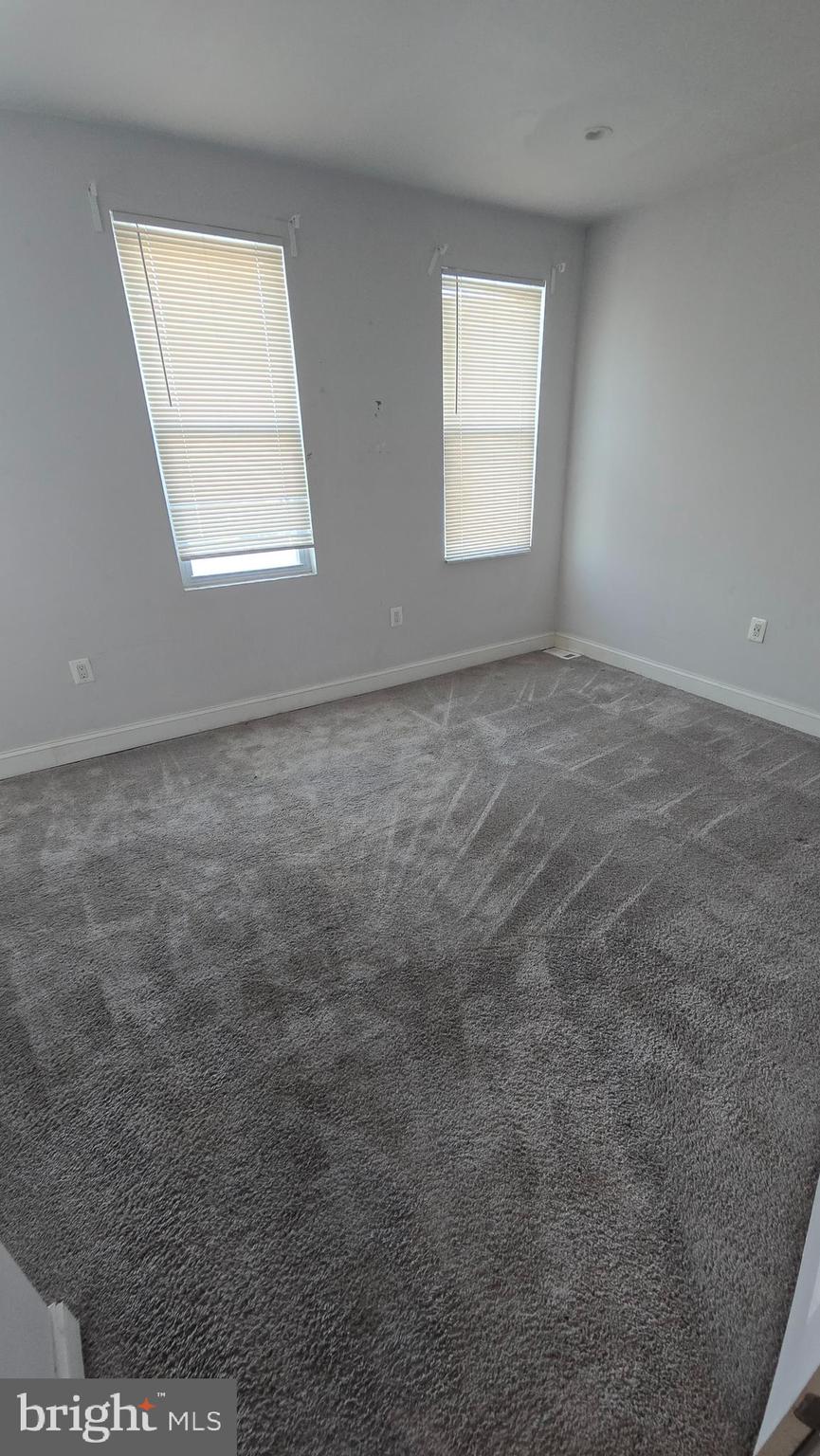 6814 Harford Road Baltimore, MD 21234 - Photo 13 of 27 an empty room with windows