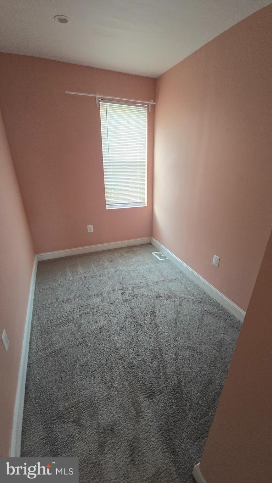 6814 Harford Road Baltimore, MD 21234 - Photo 16 of 27 an empty room with windows