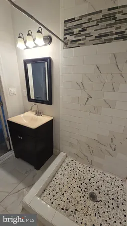a bathroom with a bathtub and a sink