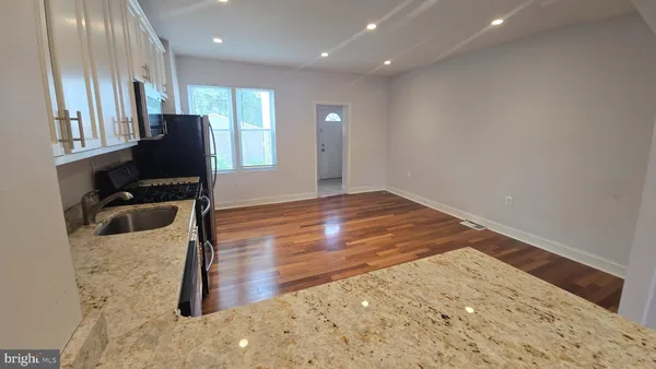 a view of a livingroom with wooden floor