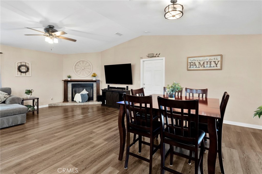 21237 S Road Apple Valley, CA 92307 - Photo 15 of 50 a view of a dining room with furniture and wooden floor